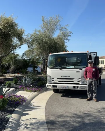 A crew member in front of a truck during a tree planting in Citrus Heights, CA